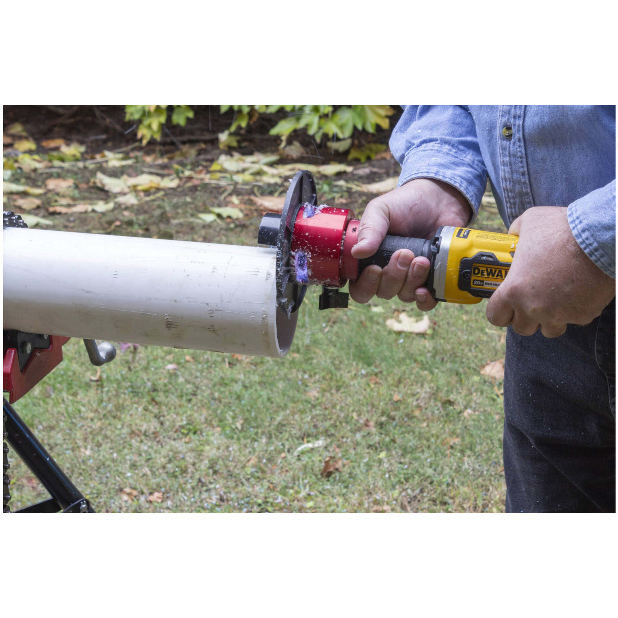 REED Bevel Boss cordless pipe beveler creating bevel on white plastic pipe