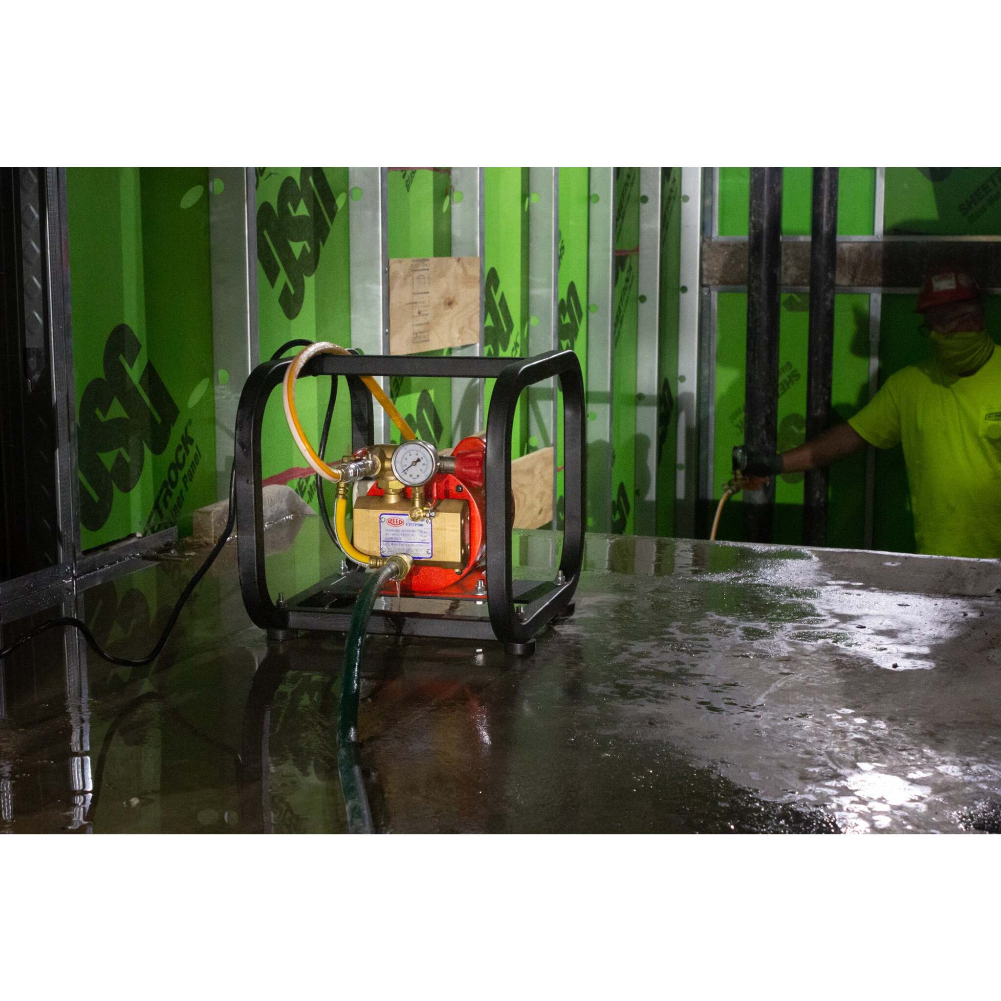 REED hydrostatic test pump performing water pressure testing onsite