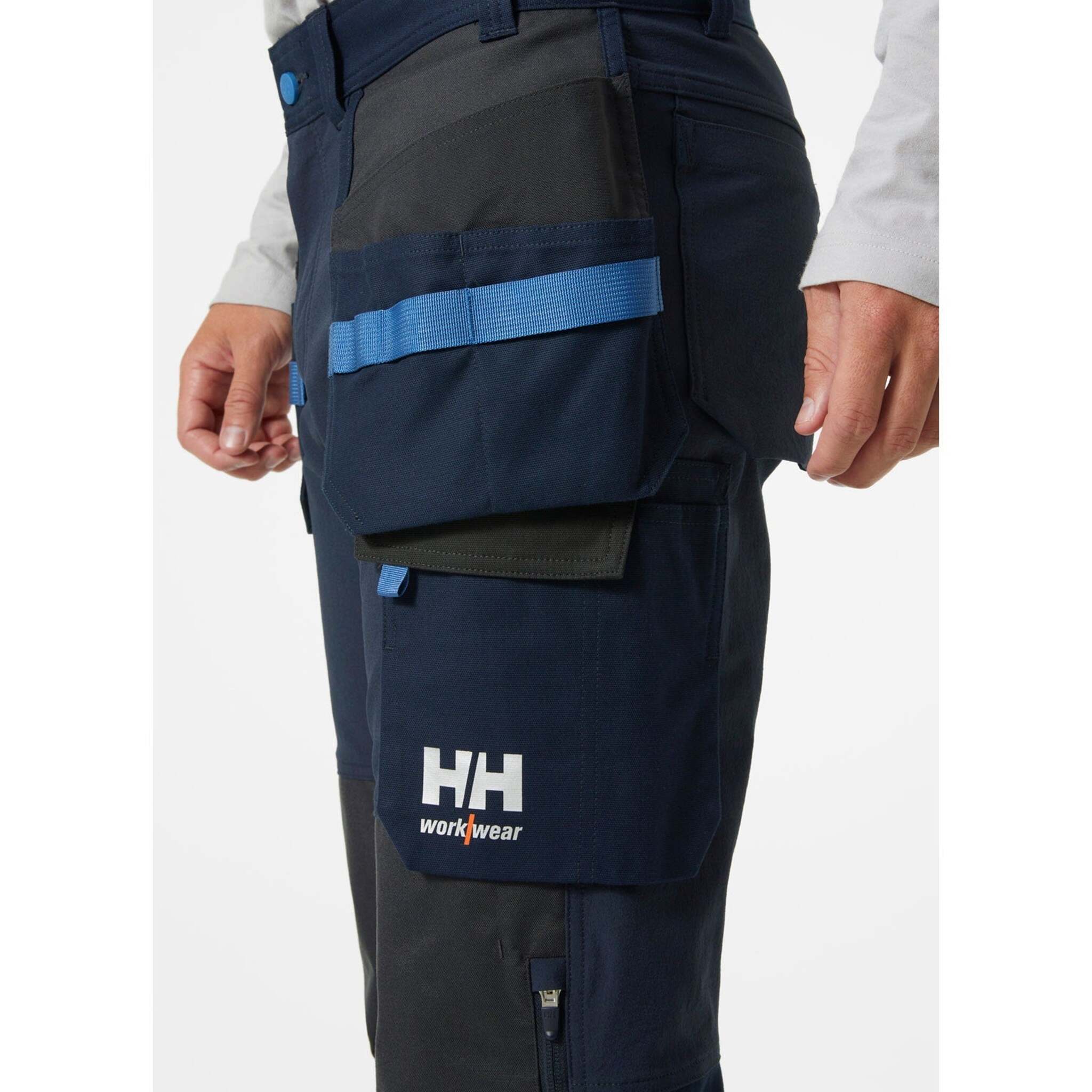 Helly Hansen Men's Construction Pants 77406 – Oxford 4X Stretch Fabric, Hanging & Knee Pad Pockets, Reinforced, Durable Workwear | Sizes 30-44 - Items