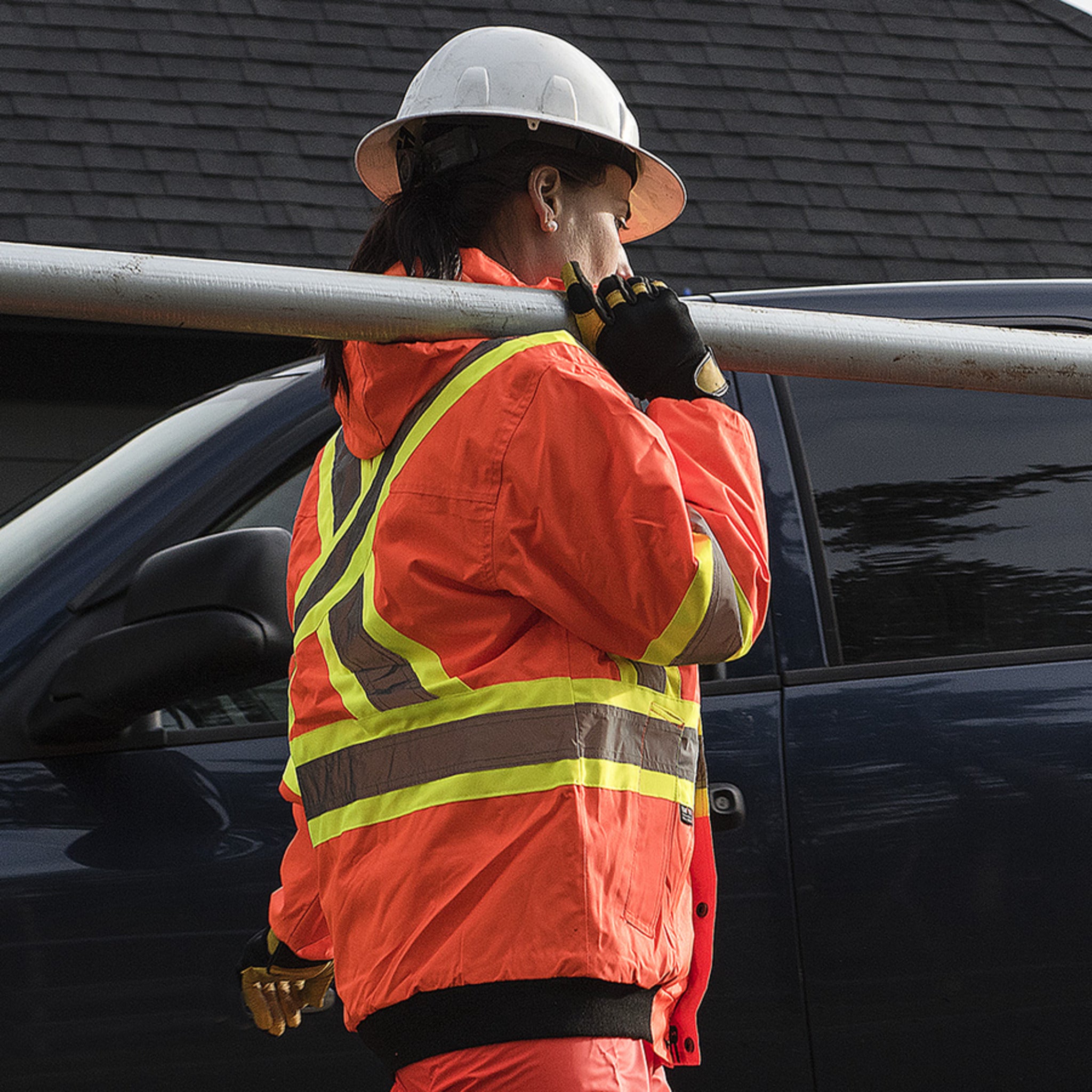 Side view of worker wearing hi vis winter work bomber jacket