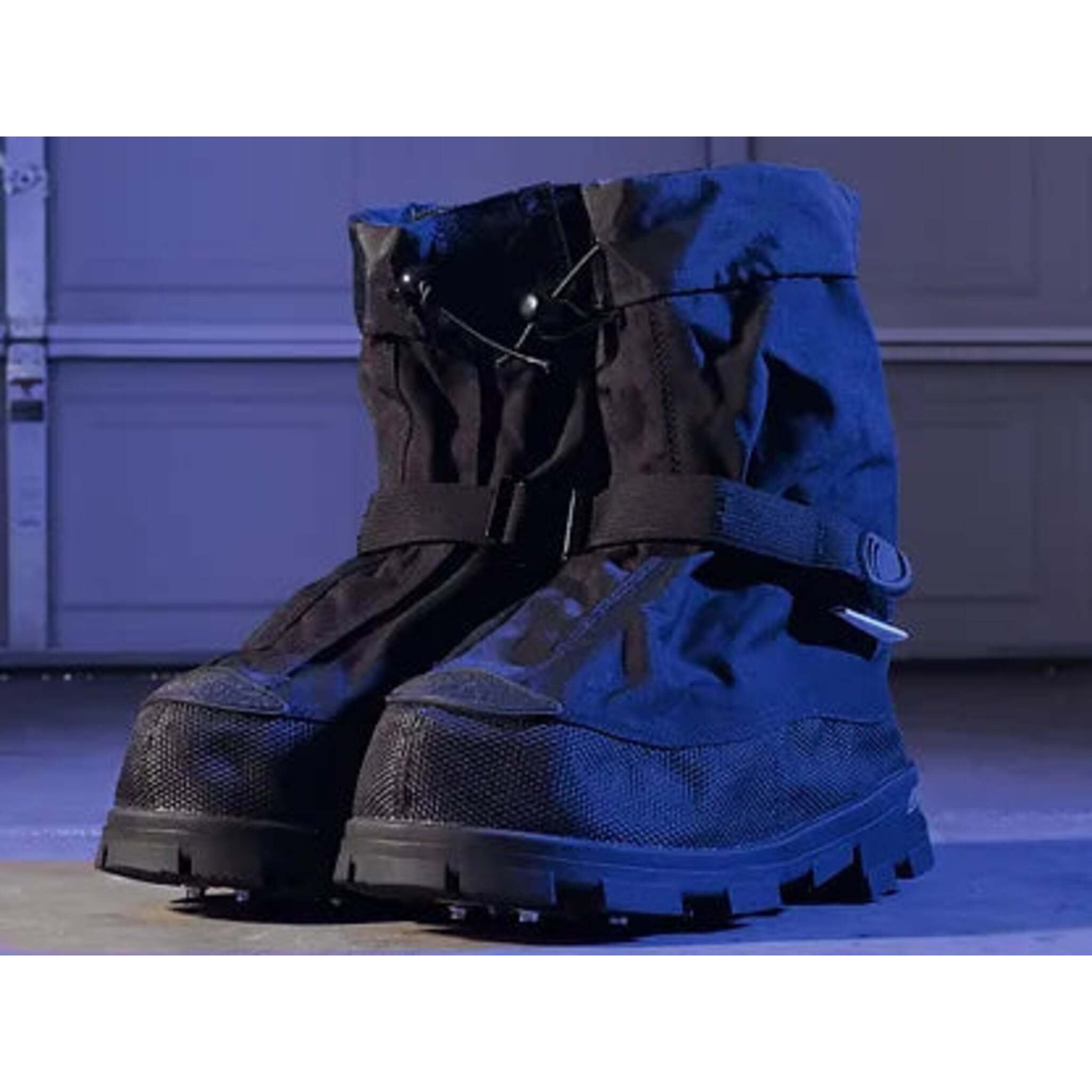 Waterproof NEOS winter overshoes providing snow traction and cold weather protection